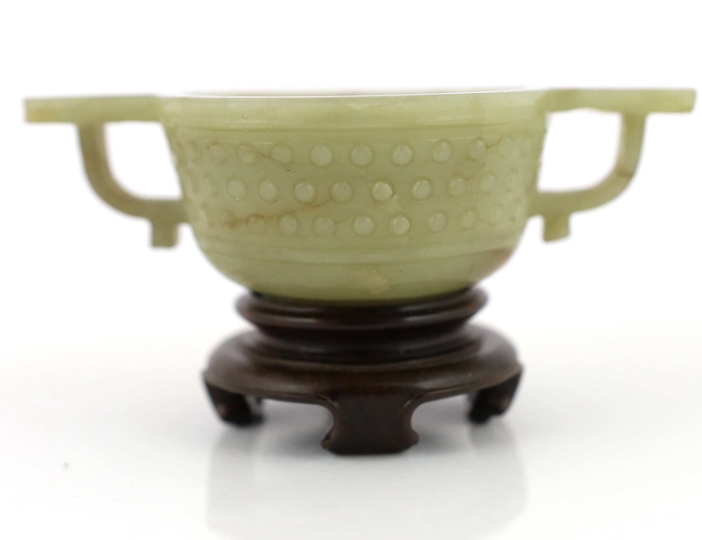 A Chinese celadon jade two handled cup, 17th century